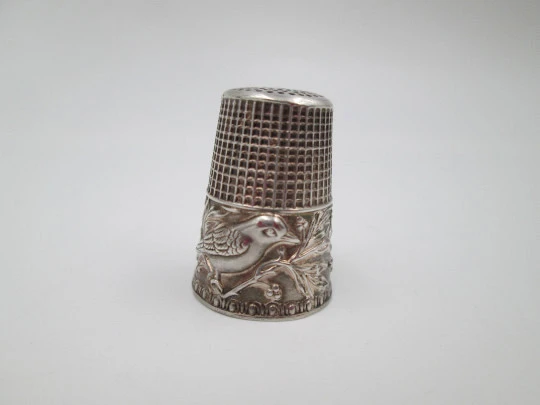 Sewing thimble. Sterling silver. Bird with leaves relief motif. Golden inside. 1960's