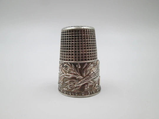 Sewing thimble. Sterling silver. Bird with leaves relief motif. Golden inside. 1960's
