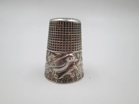 Sewing thimble. Sterling silver. Bird with leaves relief motif. Golden inside. 1960's