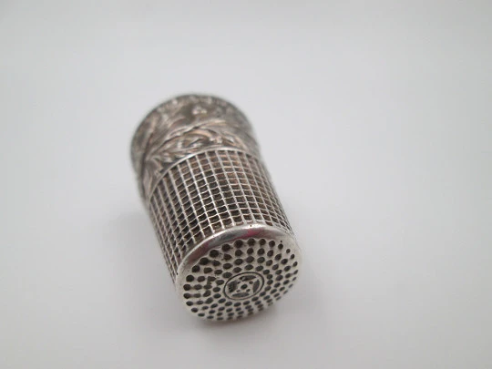 Sewing thimble. Sterling silver. Bird with leaves relief motif. Golden inside. 1960's