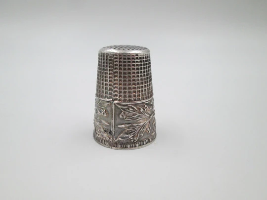 Sewing thimble. Sterling silver. Bird with leaves relief motif. Golden inside. 1960's