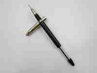 Sheaffer Crest Deluxe snorkel. Gold plated cap and black plastic barrel. 1950's. USA