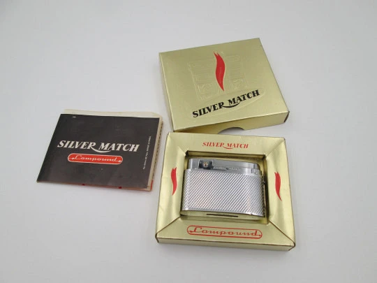 Silver Match Compound butane lighter. Silver plated metal. Linear pattern. Box. 1960's