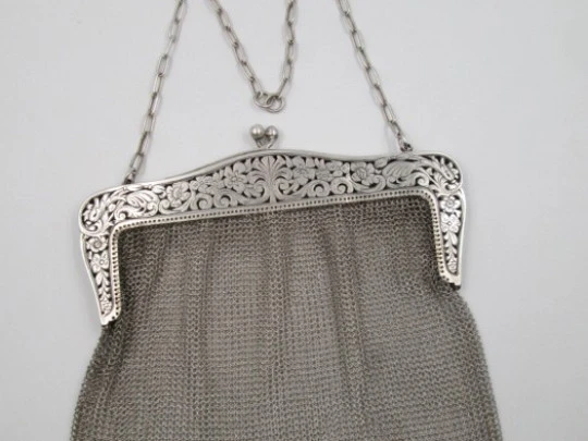 Silver mesh bag. Flowers openwork clutch frame. Chain. 1920's