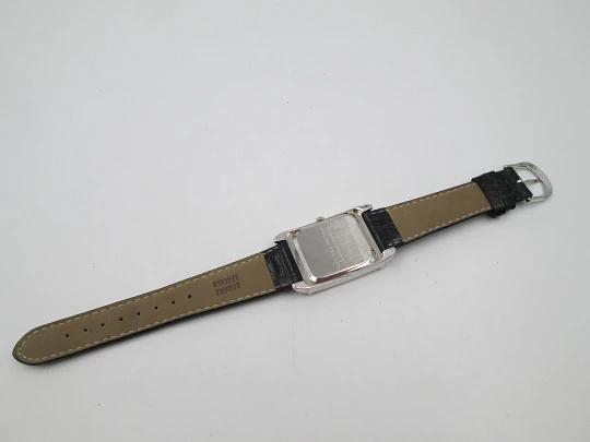 Smith Ferry. Chromed and golden metal. Steel press back. Quartz, Strap. 1980's. Japan