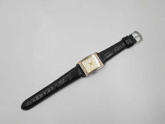 Smith Ferry. Chromed and golden metal. Steel press back. Quartz, Strap. 1980's. Japan