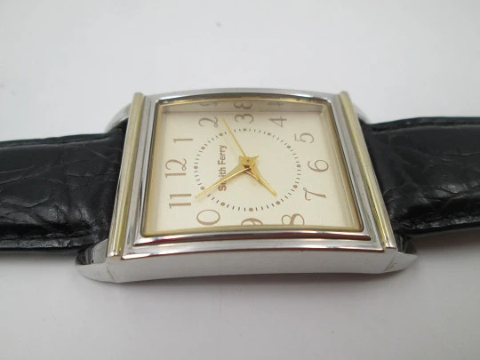 Smith Ferry. Chromed and golden metal. Steel press back. Quartz, Strap. 1980's. Japan