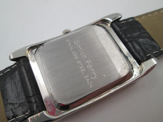 Smith Ferry. Chromed and golden metal. Steel press back. Quartz, Strap. 1980's. Japan