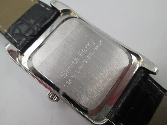 Smith Ferry. Chromed and golden metal. Steel press back. Quartz, Strap. 1980's. Japan