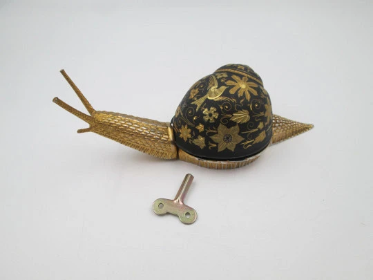 Snail desk hotel bell. Bronze and blued iron with floral damascened. Wind-up. Spain. 1960's