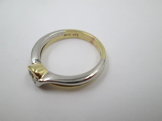 Solitario mujer. Oro amarillo y blanco 18K. Diamante brillante 0,44 quilates