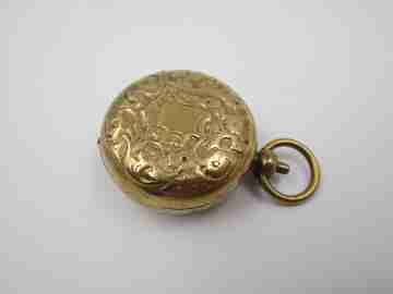 Sovereign case. Gold plated metal. Vegetable motifs. Woman bust. 1940's