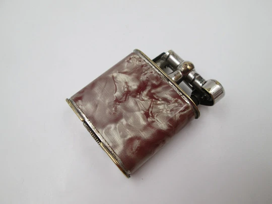 Steco pocket petrol lighter. Hammer type. Silver plated metal & marble celluloid. 1940's