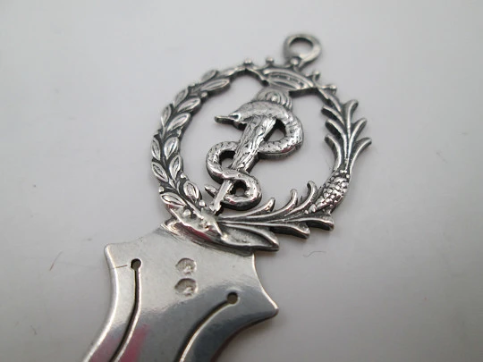 Sterling silver bookmark. Openwork pharmacy caduceus motif. Leaf wreath. 1990's. Spain