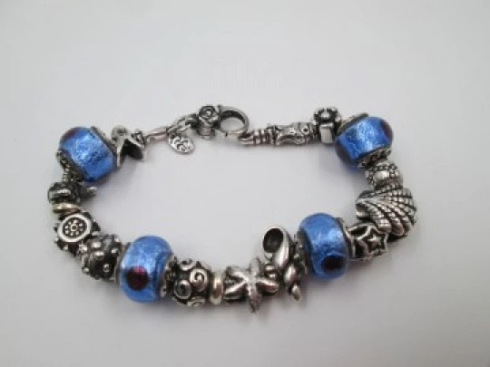 Sterling silver bracelet. Charms and bi-tone crystal balls. Italy. 2010