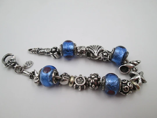 Sterling silver bracelet. Charms and bi-tone crystal balls. Italy. 2010