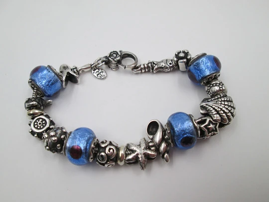 Sterling silver bracelet. Charms and bi-tone crystal balls. Italy. 2010