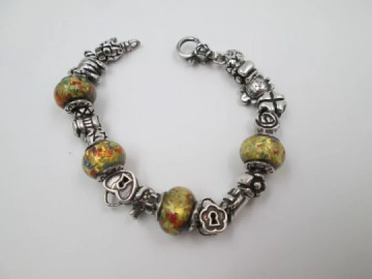 Sterling silver bracelet. Charms and painted crystal balls. Italy. 2010