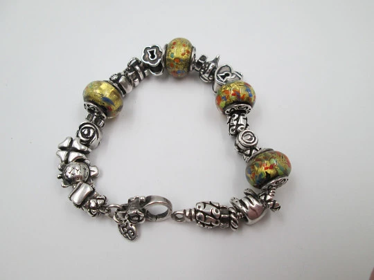 Sterling silver bracelet. Charms and painted crystal balls. Italy. 2010