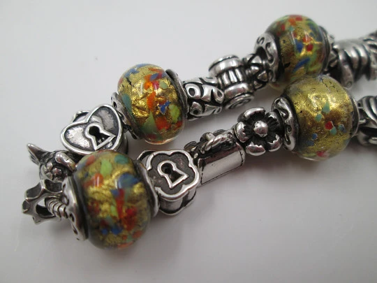 Sterling silver bracelet. Charms and painted crystal balls. Italy. 2010