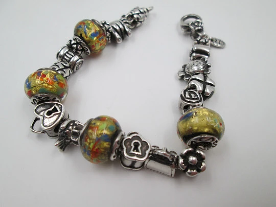 Sterling silver bracelet. Charms and painted crystal balls. Italy. 2010