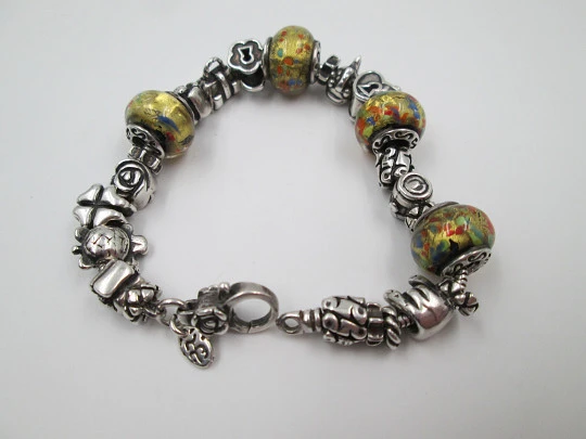 Sterling silver bracelet. Charms and painted crystal balls. Italy. 2010