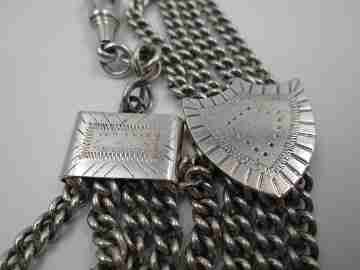 Sterling silver chatelaine. Four chains. Sliding shield. Cow charm. 1910's