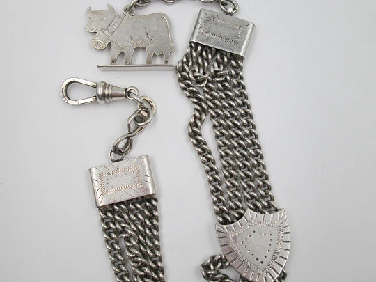 Sterling silver chatelaine. Four chains. Sliding shield. Cow charm. 1910's