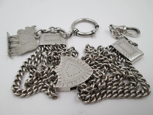 Sterling silver chatelaine. Four chains. Sliding shield. Cow charm. 1910's