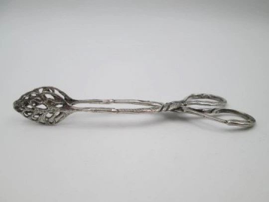 Sterling silver ornate ice tongs. Vegetable motifs and scrolls. 1960's. Spain