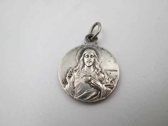 Sterling silver religious medals. Sacred Heart of Jesus and Virgin with Crescent Moon. 1920's Sterling silver religious medals. Sacred Heart of Jesus and Virgin with Crescent Moon. 1920's