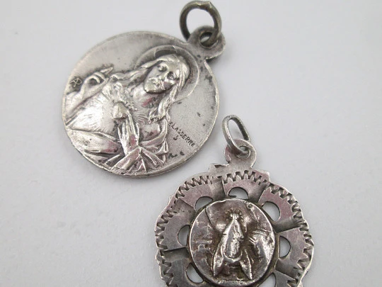 Sterling silver religious medals. Sacred Heart of Jesus and Virgin with Crescent Moon. 1920's Sterling silver religious medals. Sacred Heart of Jesus and Virgin with Crescent Moon. 1920's