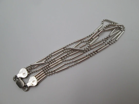 Sterling silver women's bracelet. Four chains of cylinders and balls. 1980's