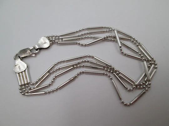 Sterling silver women's bracelet. Four chains of cylinders and balls. 1980's