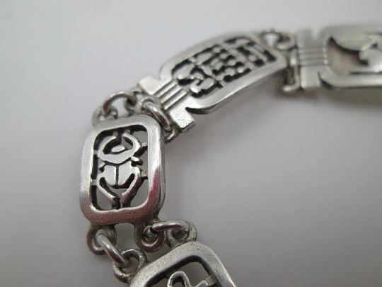 Sterling silver women's bracelet. Openwork egyptian motifs. 1990's