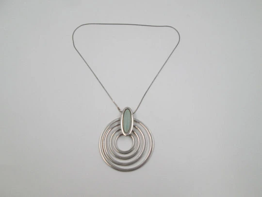 Sterling silver women's necklace. Concentric circles pendant with cord. Blue stone. 1980's