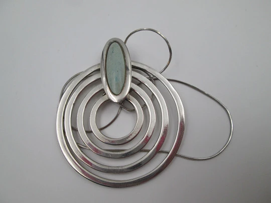 Sterling silver women's necklace. Concentric circles pendant with cord. Blue stone. 1980's