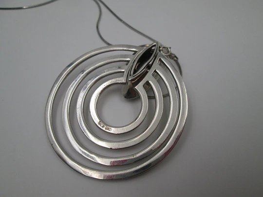 Sterling silver women's necklace. Concentric circles pendant with cord. Blue stone. 1980's