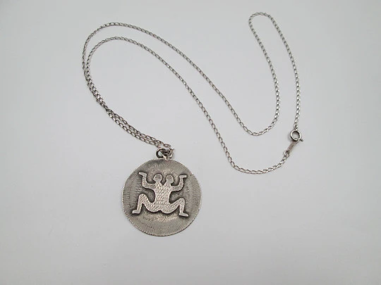Sterling silver women's necklace. Open links chain and symbol round pendant. 1980's Sterling silver women's necklace. Open links chain and symbol round pendant. 1980's