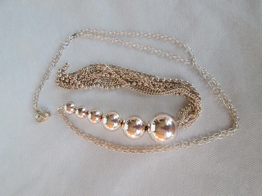 Sterling silver women's necklace. Six spheres. Chains tassel. 1980's