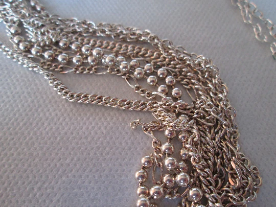 Sterling silver women's necklace. Six spheres. Chains tassel. 1980's