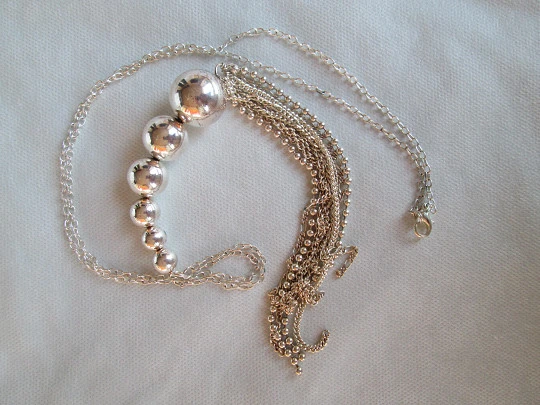 Sterling silver women's necklace. Six spheres. Chains tassel. 1980's