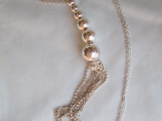 Sterling silver women's necklace. Six spheres. Chains tassel. 1980's