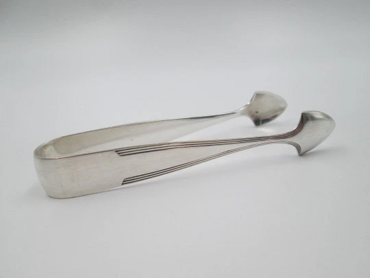Sugar tongs. Silver plated metal. Ribbed design and triangular head. Europe. 1950's