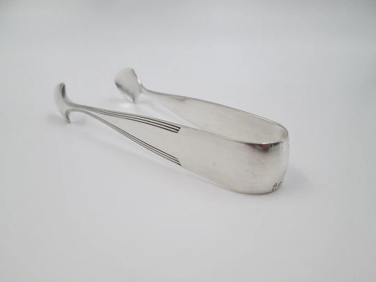 Sugar tongs. Silver plated metal. Ribbed design and triangular head. Europe. 1950's