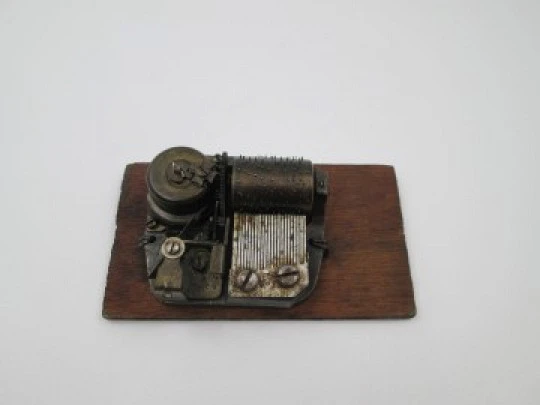 Swiss music box mechanism. Wind up movement. Wood stand. 1940's