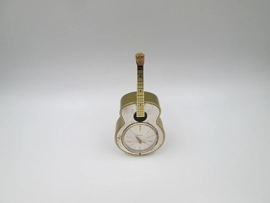 Swiza musical table alarm clock. Hand winding. Bronze. Sheffield guitar shape. 1970's