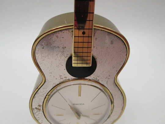 Swiza musical table alarm clock. Hand winding. Bronze. Sheffield guitar shape. 1970's
