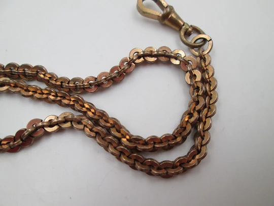 T-bar key pocket watch braided links chain. Gold plated metal. Carabiner clasp. Europe