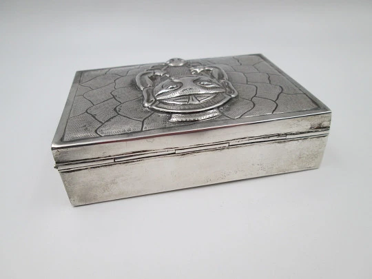 Table desk tobacco case. White alpaca. Articulated lid. Inca idol motif. 1980's